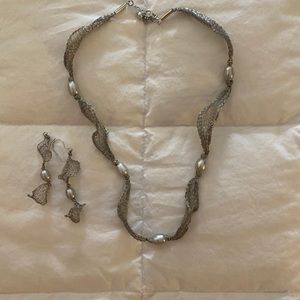 Silver mesh matching necklace and earrings.